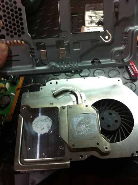 File:02- Remove the fan screws to detach it from the metal cage.jpg