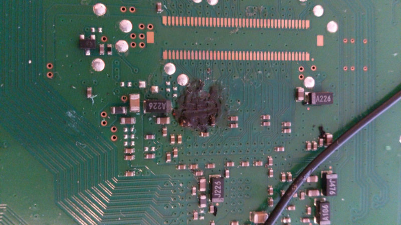 File:Burned out motherboard because of fast dualboot soldering failure.jpg