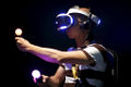 E3 - A user trying out Morpheus + Move controllers and wired Headset